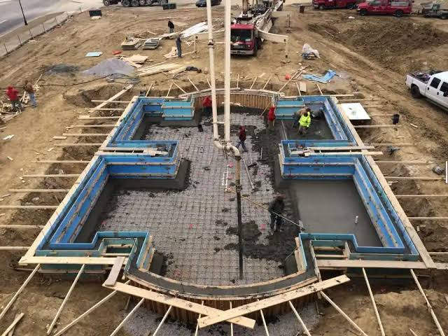 Concrete foundation formwork and pour on construction site